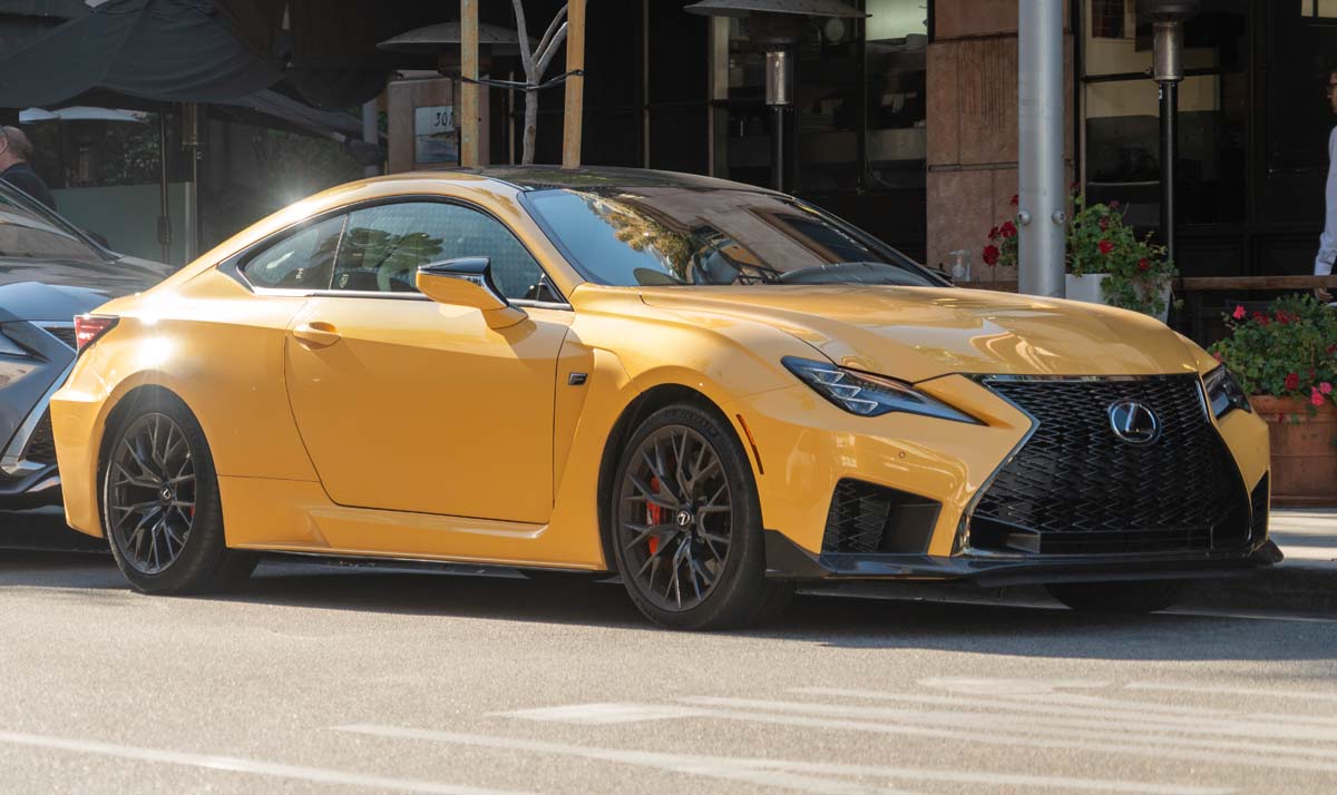 2023 Lexus RC F parked just off of rodeo drive in Beverly Hills with metlalic yellow paint and carbon fiber pacakge