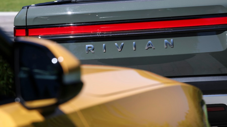 The Rivian logo is seen on a Rivian R1T Truck parked outside the Allen & Company Sun Valley Conference. The cheapest Rivian R1T price is pretty high still.