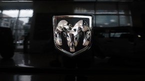 The logo of a Ram 1500 Classic on a black truck.