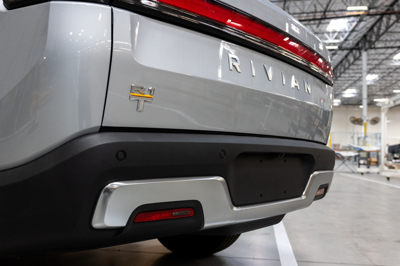 An R1T model electric truck on the pilot production line at Rivian's headquarters. The Rivian R1T's range is a big con.