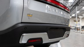 An R1T model electric truck on the pilot production line at Rivian's headquarters. The Rivian R1T's range is a big con.