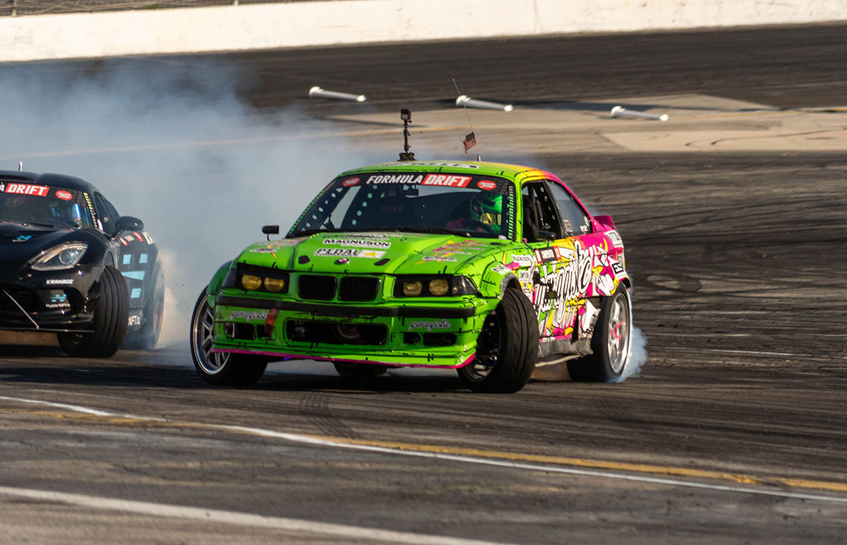 Rome Charpentier pilots his LS-swapped E36 BMW 3 Series at the mid clipping point in Irwindale California at Irwindale Speedway