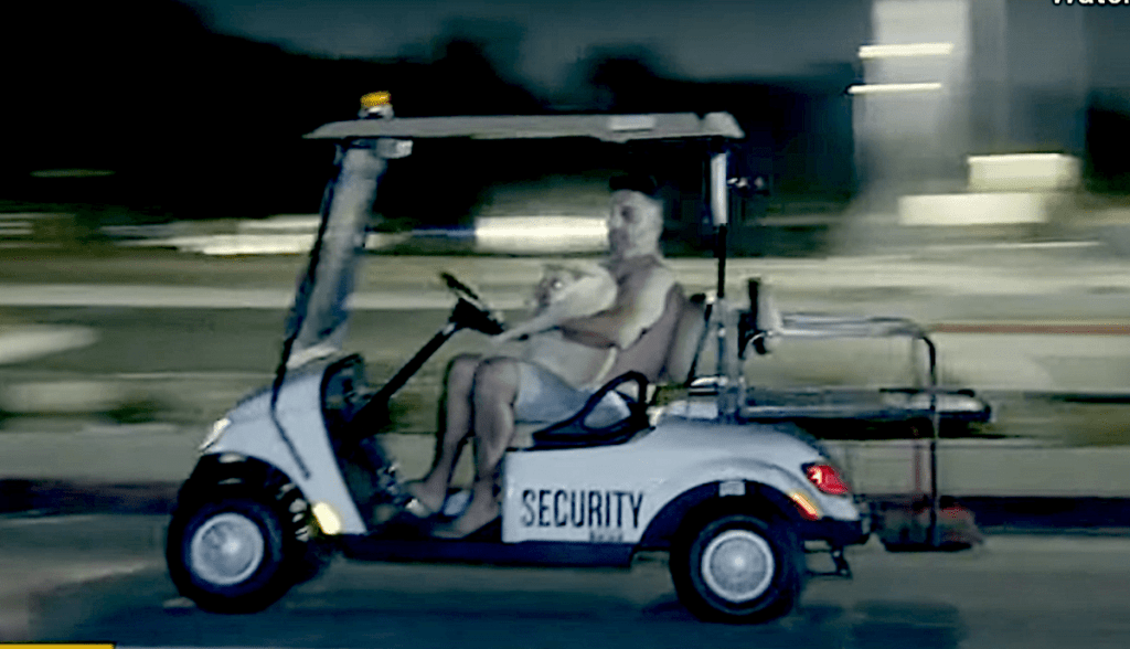 Police chase golf cart side view at night
