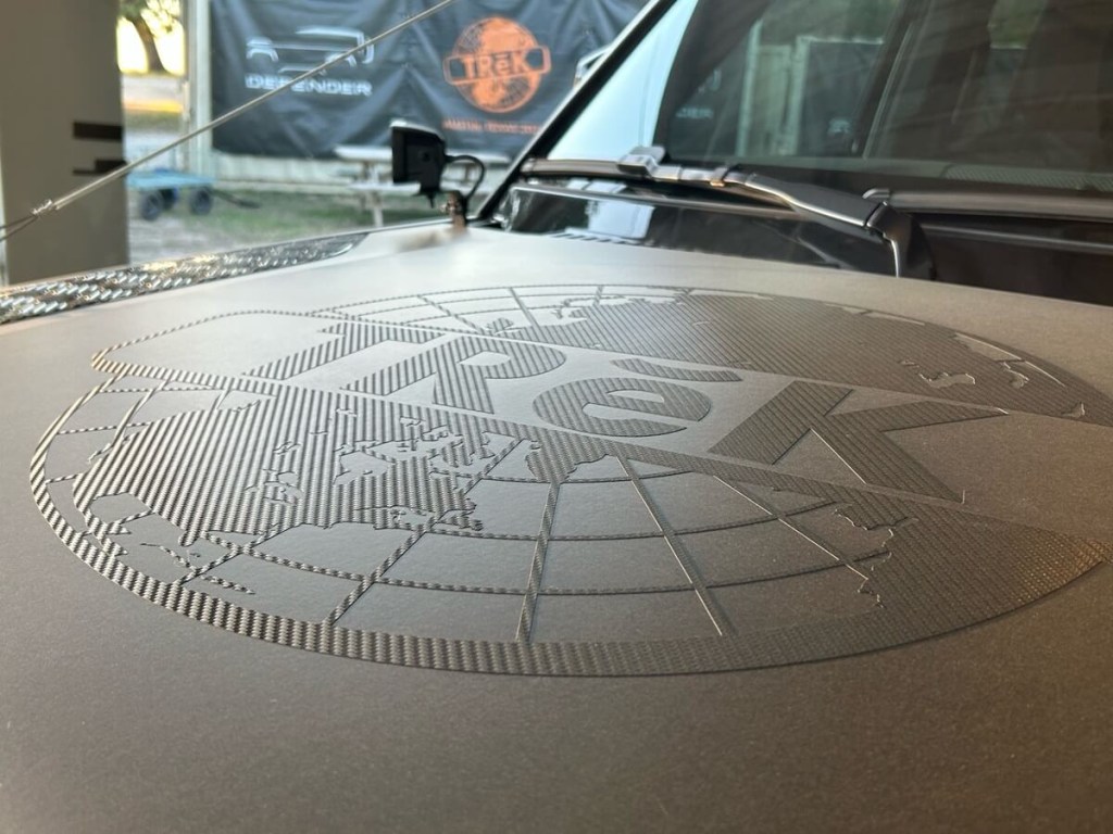 Land Rover's TReK 2023 logo on an official vehicle.