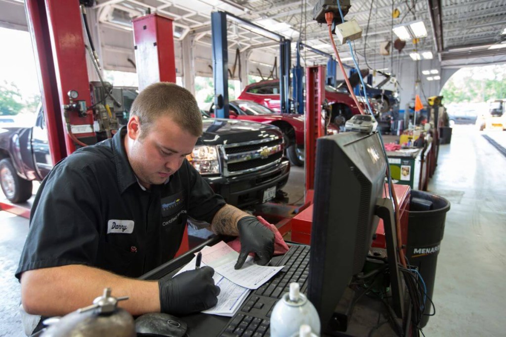 A technician at the Raymond Chevrolet dealership in Antioch, Illinois, working on vehicle recall paperwork