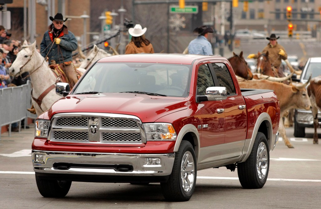 2009 Dodge Ram pickup truck with rodeo behind it