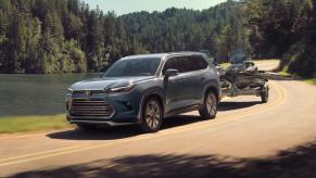 The 2024 Toyota Grand Highlander Hybrid Max towing jet skis