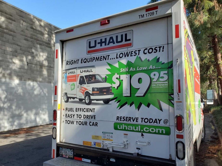 The back door of a U-Haul truck with a $19.95 price sign.