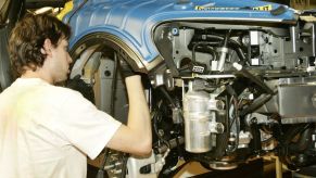 Workers assembling vehicles and differentials at a Volvo car plant in Ghent, Belgium