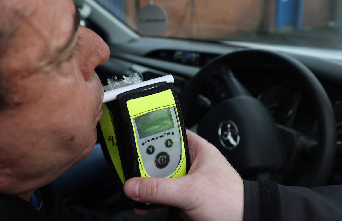 A driver takes a breathalyzer test