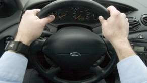 Hands on a steering wheel