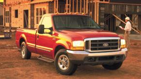 A 1999 Ford F-250 Super Duty heavy-duty pickup truck with the 7.3L diesel Power Stroke engine parked on dirt