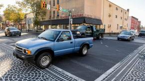 Vehicles in different street lanes in Reading, Pennsylvania, driving through an intersection