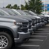 A row of Chevrolet Silverado pickup trucks on a used car lot in Ohio, the cheapest state to buy used cars in America.