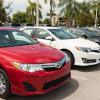 A lot full of used cars outside of West Palm Beach, Florida shows off its Toyota sedans.