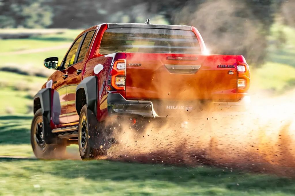 2024 Toyota HiLux pickup kicking up dirt