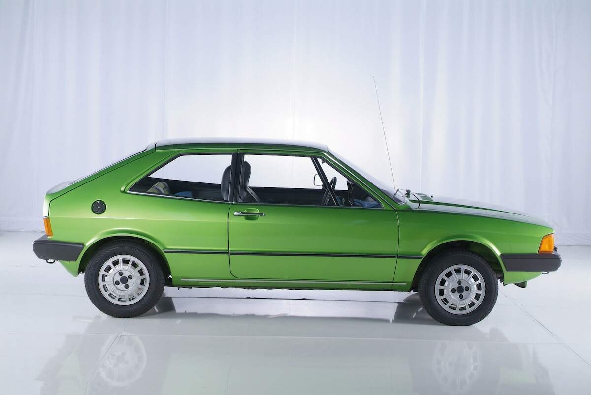 A lime-green 1978 Volkswagen Scirocco GT in a white room