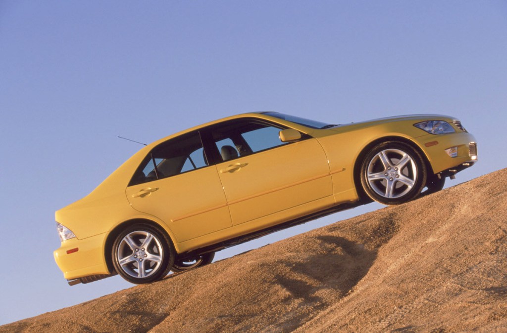 A side view of a yellow 2002 Lexus IS 300