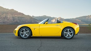 Yellow 2008 Pontiac Solstice GXP turbocharged convertible sports car sold on Cars and Bids for under $15,000