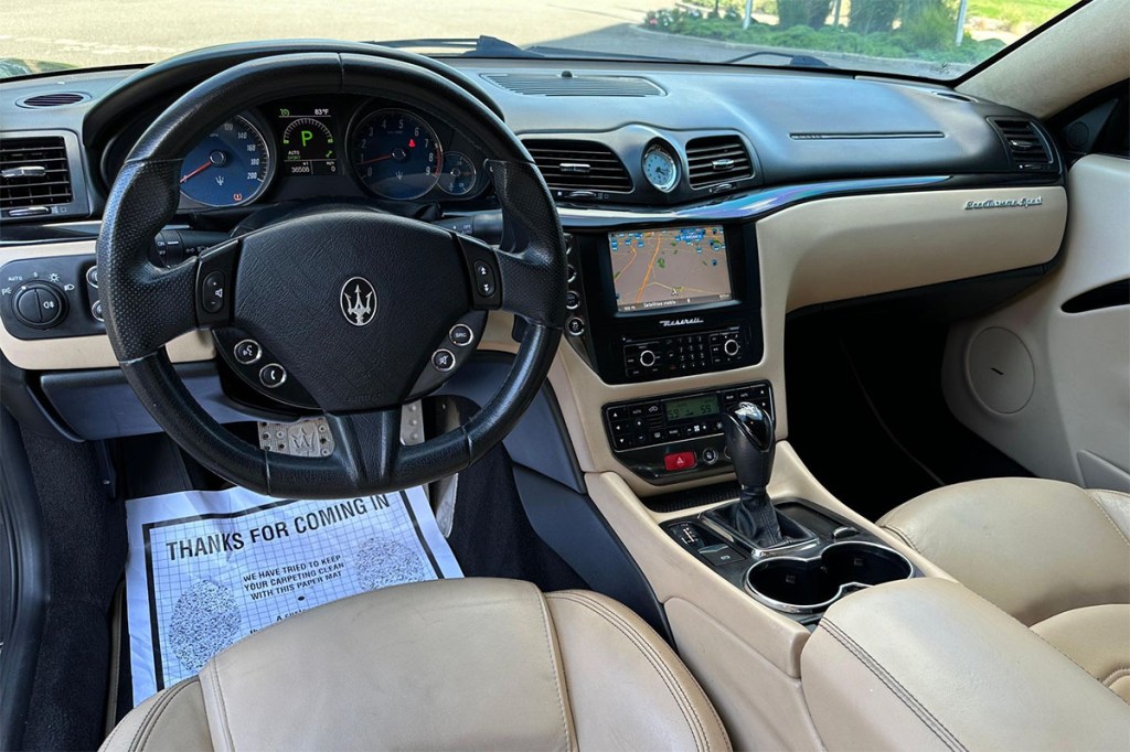 Tan leather interior of 2013 Maserati GranTurismo that sold for wildly cheap on Cars and Bids