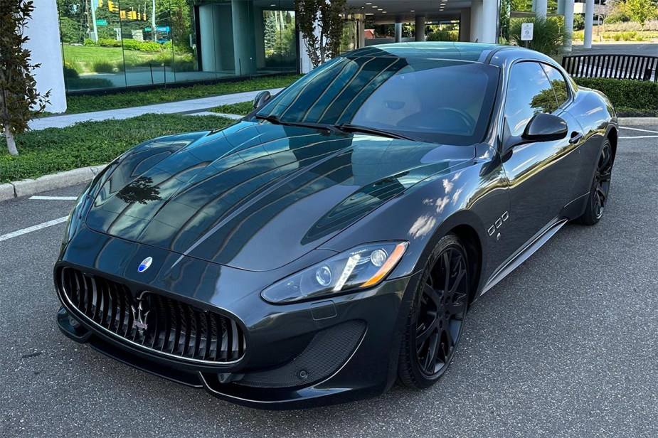 2013 Maserati Granturismo Sport coupe front 3/4 in black sold used for cheap on Cars and Bids