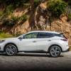 2023 Nissan Murano in white driving next to a cliff. The 2023 Nissan Murano's resale value is surprisingly low
