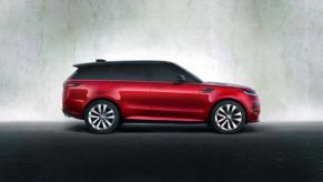 A red 2023 Range Rover Sport on display.