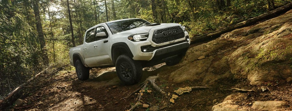 The 2023 Toyota Tacoma off-roading in the woods