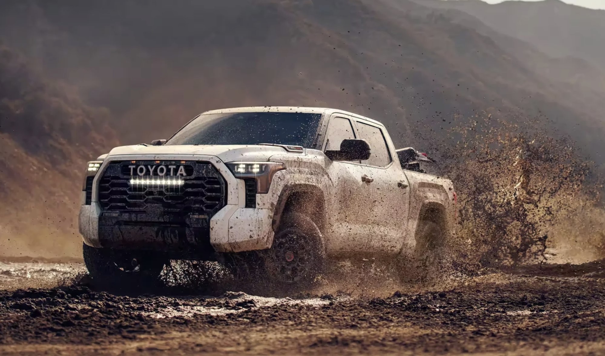 The 2024 Toyota Tundra TRD Pro off-roading in mud