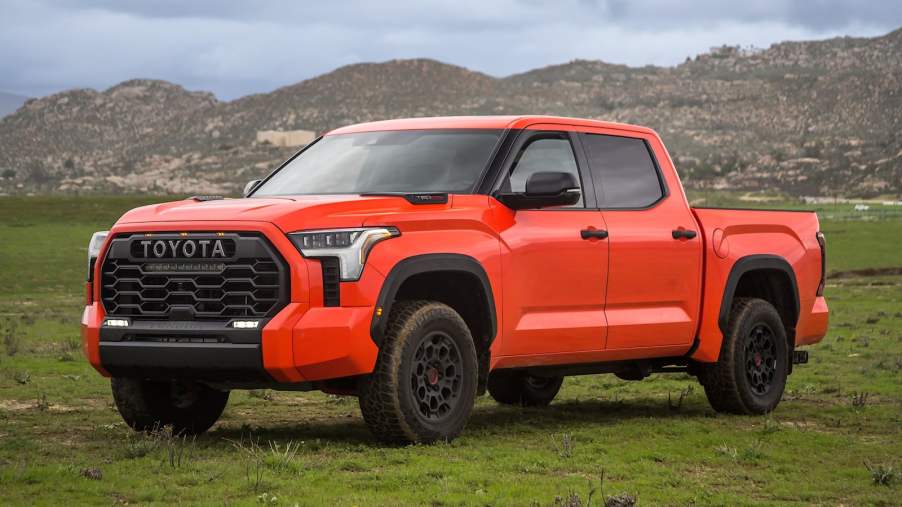 The 2023 Toyota Tundra parked in a grassy field