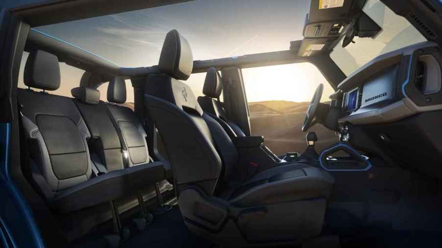 2023 Ford Bronco interior view with top off roll bars at sunset