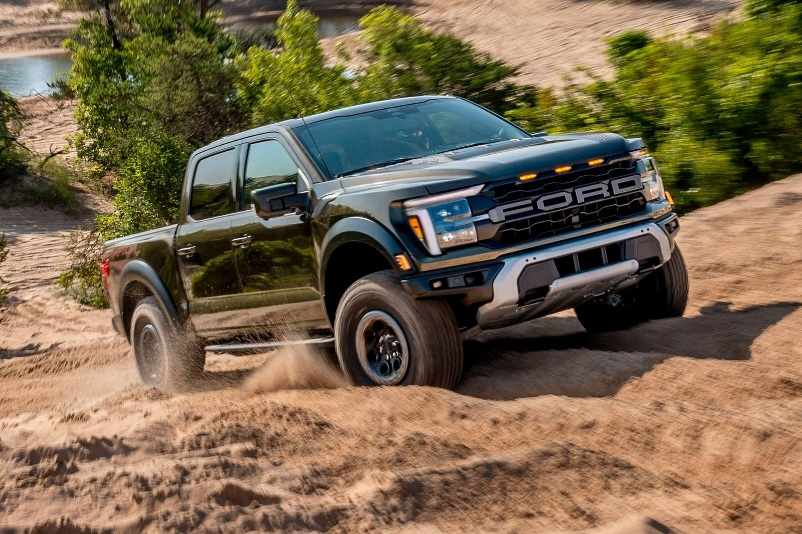 The 2024 Ford F-150 off-roading in the dirt
