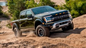 The 2024 Ford F-150 off-roading in the dirt