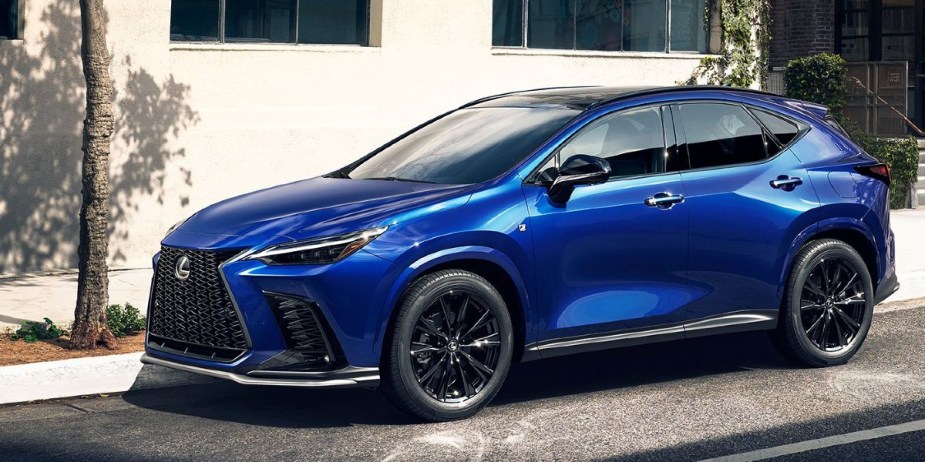 A blue 2024 Lexus NX small luxury SUV is parked. 