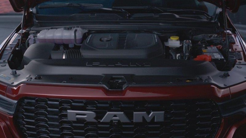 The 3.0-liter Hurricane straight-six (I6) engine under the hood of a red 2025 Ram 1500 pickup truck.