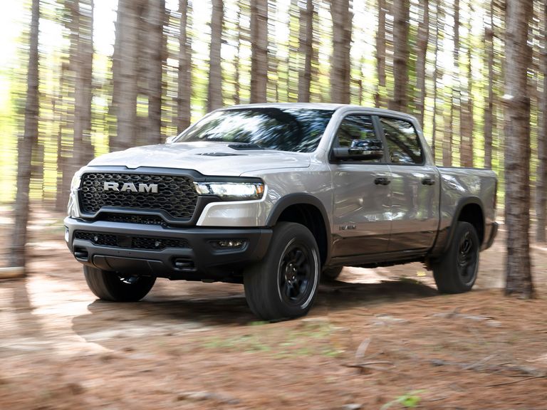 The 2025 Ram 1500 off-roading in the woods
