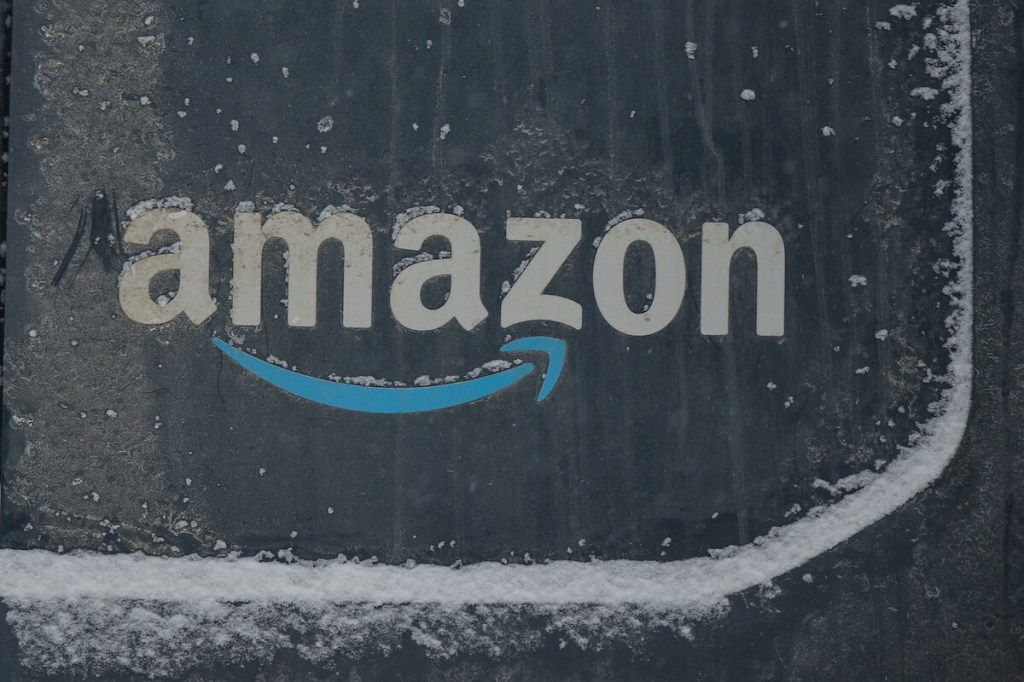 The Amazon logo on a van. 