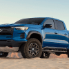 Blue 2023 Chevrolet Colorado pickup truck on dirt