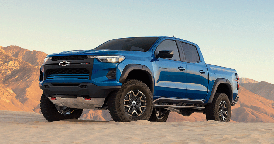 Blue 2023 Chevrolet Colorado pickup truck on dirt