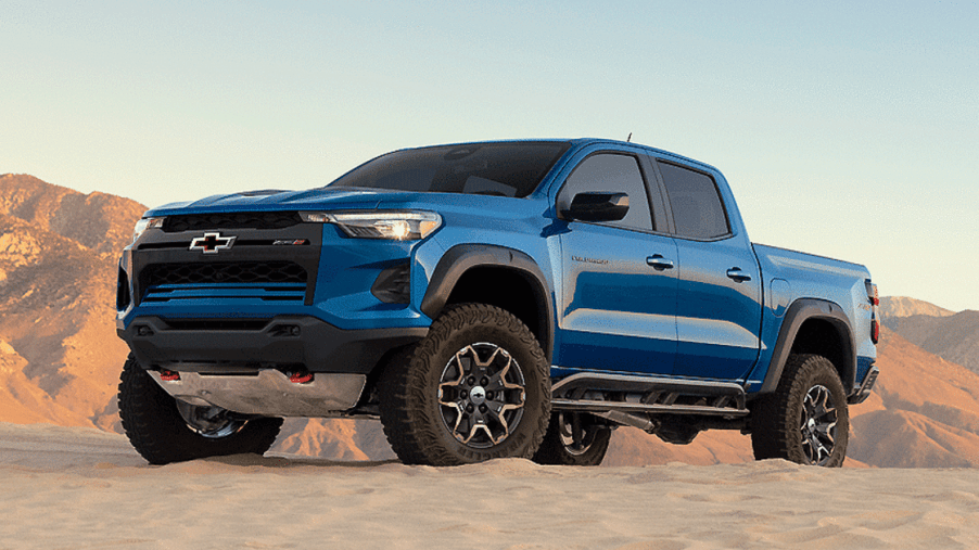 Blue 2023 Chevrolet Colorado pickup truck on dirt