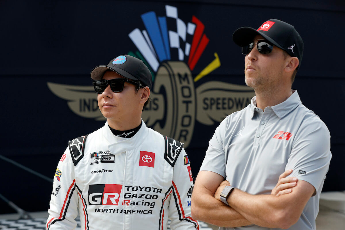 Denny Hamlin and Kamui Kobayashi stand together.