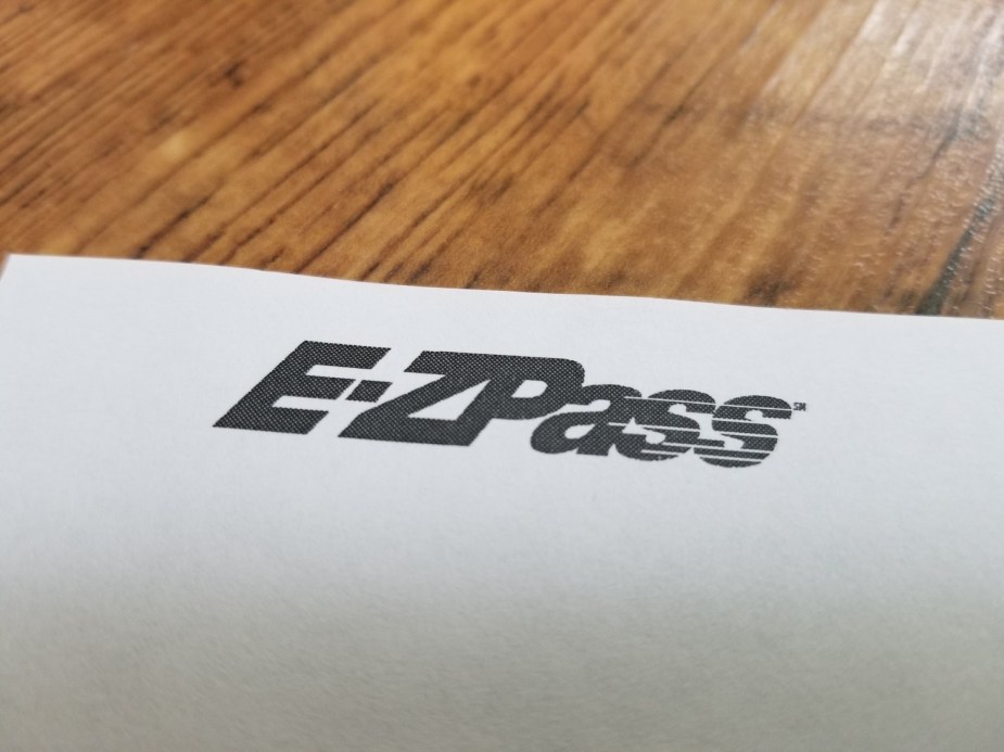 The E-ZPass log at the top of an unpaid toll bill with late fees.