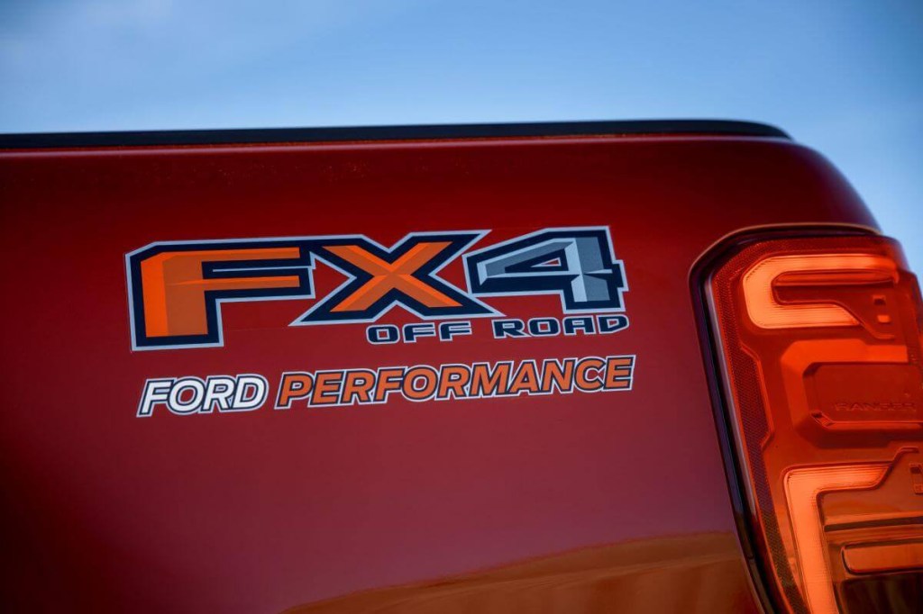A Ford Ranger midsize pickup truck with FX4 off-road performance package branding on its rear bed