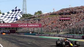 A black and white checkered flag being waved at the Formula 1 Grand Prix of Hungary