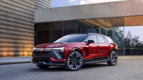 A 2024 Chevy Blazer EV RS all-electric compact SUV model in the Radiant Red Tintcoat paint color option