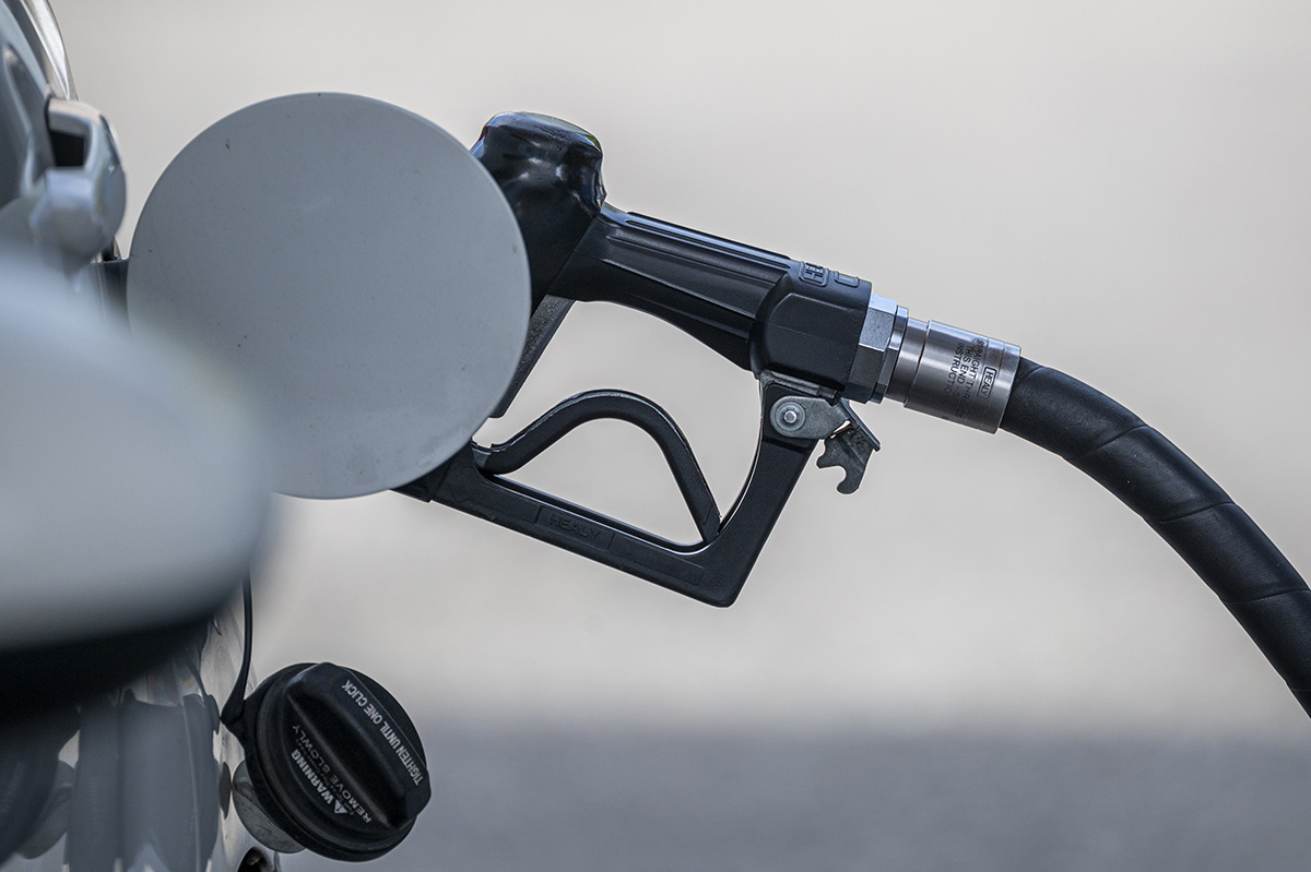 Gas pump inserted in car