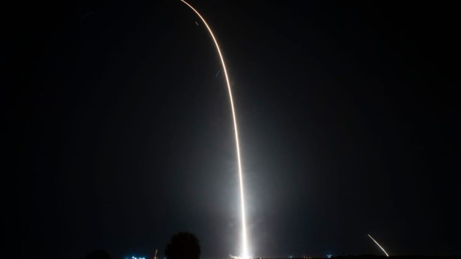A rocket launch sends a Falcon 9 vehicle into space.