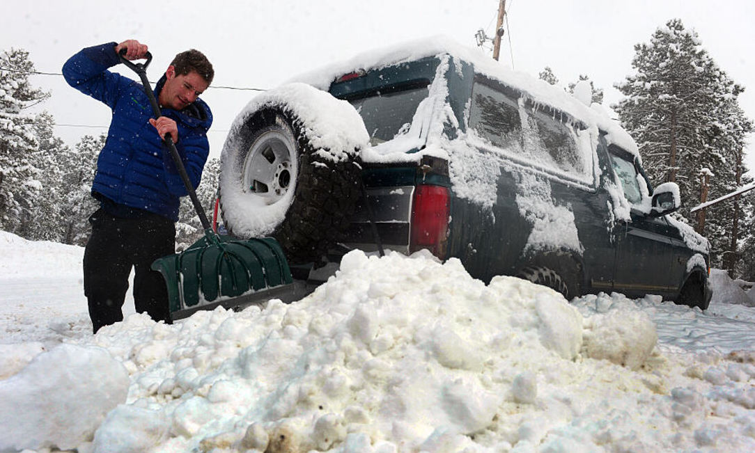 Digging out car stuck in snow 