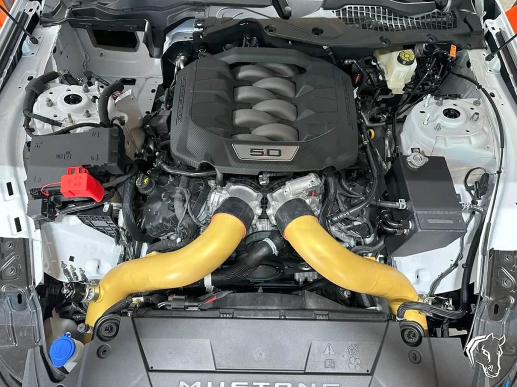A Hellhorse Performance mid-mount twin-turbo kit on a Coyote 5.0L V8 in a 2024 Ford Mustang GT.