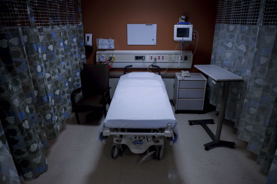 An empty bed in a hospital's critical care unit.